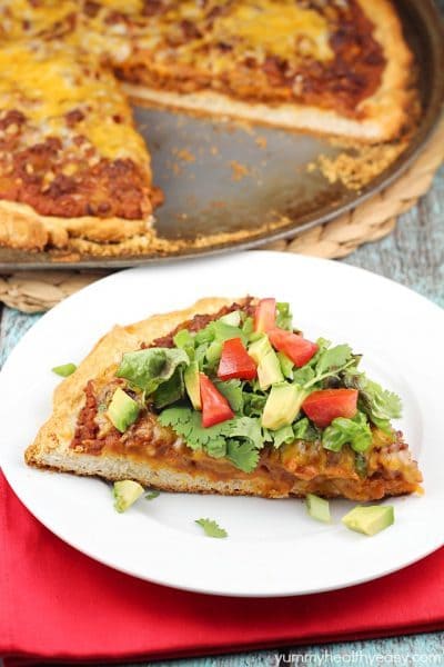 Easy Tostada Pizza is a fun cross between a taco, pizza and a tostada! Yummy, quick & easy dinner for any night of the week!