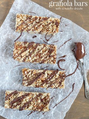 Top view of Easy No-Bake Granola Bars with oats, almonds and coconut with a delicious chocolate & Nutella drizzle on top + 43 Healthy Snack Ideas
