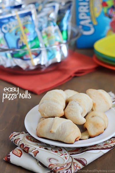 Simple & delicious Pizza Rolls made from ready-made pizza dough, mozzarella sticks, pizza sauce and pepperoni all rolled together in a fun little bite and served with a refreshing Capri Sun! #ad