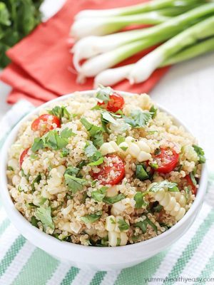 Quinoa Salad full of healthy quinoa, grilled corn, cherry tomatoes, cilantro and spices. Delicious!