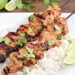 Marinated and grilled Thai Coconut Chicken Skewers over a bed of delicious coconut rice!