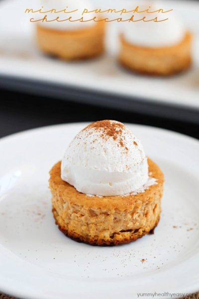 Perfect single-size Mini Pumpkin Cheesecakes full of soft, creamy, pumpkin yumminess and less than 160 calories per cheesecake! Best fall dessert yet!