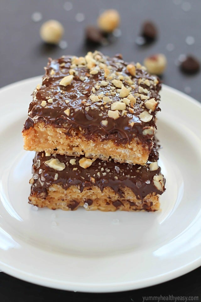 A layer of peanut butter Rice Kripsie treats topped with a layer of dark chocolate, hazelnuts and a little bit of sea salt. These scotcheroos will knock your socks off!