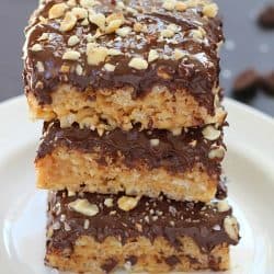 A layer of peanut butter Rice Kripsie treats topped with a layer of dark chocolate, hazelnuts and a little bit of sea salt. These scotcheroos will knock your socks off!