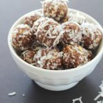A white bowl full of No-Bake Nut & Date Energy Balls