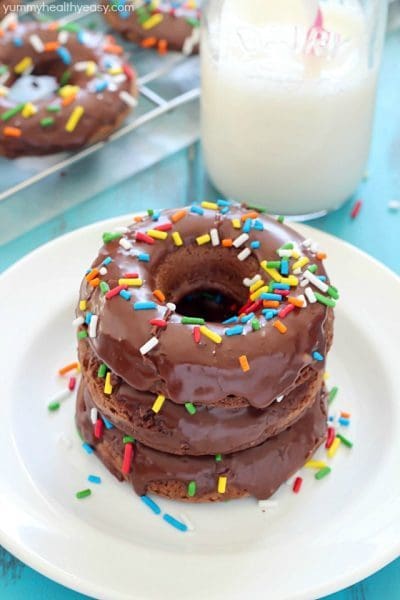 Delicious Baked Chocolate Cake Donuts that are soft, chocolatey and light with the best chocolate glaze on the top. And of course, sprinkles too. :) #CAdairy #ad