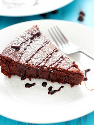 Flourless Chocolate Cake is made with a secret ingredient instead of flour... ;) The most incredible moist, fudgy, decadent cake that's incredibly light and crumbly all at the same time! Perfect Valentine's Day dessert! #truvia