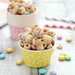 Super delicious and easy Bunny Bait aka Easter Snack Mix. Made with cereal, pretzels, peanuts, pastel M&M candies and white chocolate - perfect for Easter!