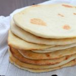 Ever tried naan bread? It's a leavened, oven-baked flatbread found in Indian cuisine - and it's delicious! Here's an easy homemade naan bread recipe you can make right at home!