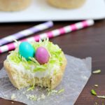 Need a fun treat to make for an Easter get together? Make these darling Easter Nest Sugar Cookie Cups! Sugar cookie dough cooked in a muffin tin, filled with vanilla frosting, topped with green tinted coconut and M&M eggs to look like a little bird's nest. So cute and great for spring! #truvia
