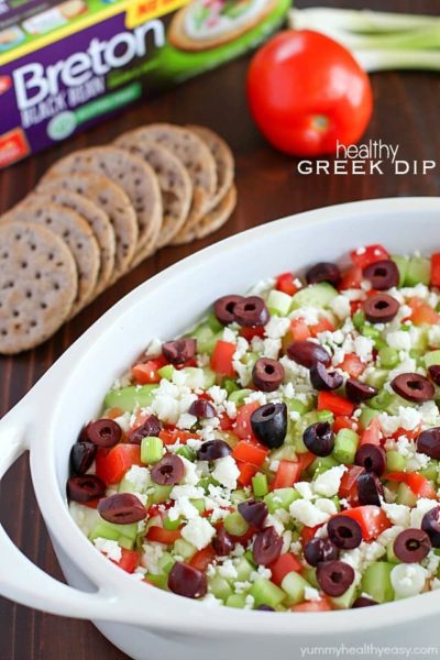 Deliciously healthy greek dip, made with a protein-rich cottage cheese base (with ranch seasonings!) then topped with cucumbers, green onions, tomatoes, kalamata olives, and feta cheese. Healthy and full of flavor! #breton #ad