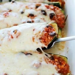 Healthy Black Bean & Quinoa Stuffed Zucchini - a hearty and easy meatless side dish or dinner that's gluten-free and clean-eating. So delicious, you won't even think it's healthy!