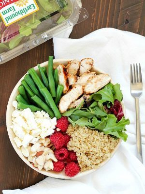 Check out this yummy salad bowl recipe full of grilled chicken, cooked quinoa, kale, raspberries, sliced almonds, feta cheese, green beans and a homemade basil vinaigrette. Super healthy and absolutely delicious! #OrganicBound #Ad