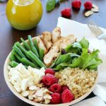 Check out this yummy salad bowl recipe full of grilled chicken, cooked quinoa, kale, raspberries, sliced almonds, feta cheese, green beans and a homemade basil vinaigrette. Super healthy and absolutely delicious! #OrganicBound #Ad