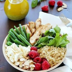 Check out this yummy salad bowl recipe full of grilled chicken, cooked quinoa, kale, raspberries, sliced almonds, feta cheese, green beans and a homemade basil vinaigrette. Super healthy and absolutely delicious! #OrganicBound #Ad