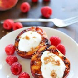 Don't put away that grill after dinner! Throw some peaches on and let them caramelize with brown sugar, then fill them with yogurt. This healthy & easy grilled peaches dessert will blow your mind! #truvia #ad