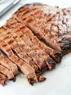 This Asian Marinated Flank Steak has few ingredients but tastes AMAZING!! Super simple and doesn't take long to cook, but is flavorful, juicy and tender. A must-make!