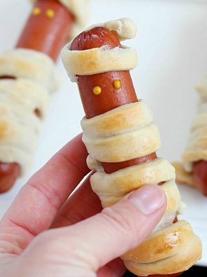Looking for a fun, kid-friendly dinner for Halloween? Make these Hot Dog Mummies aka Mummy Dogs! A super cute and really easy recipe with only two main ingredients!