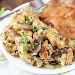 So many great spices & flavors going on in this Crock Pot Stuffing Recipe! It beats the pants off of those other blah stuffing recipes. Plus it's cooked in the slow cooker, so you can put it in hours before dinnertime and not even think about it until you eat! Perfect for Thanksgiving or any other day of the year!