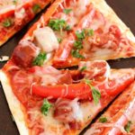 This Copycat Olive Garden Pepperoni & Sausage Flatbread Pizza is such a quick and easy dinner! Flatbread is layered with marinara sauce, roasted red peppers, pepperoni, sausage & cheese then baked. So easy and so delicious!! AD