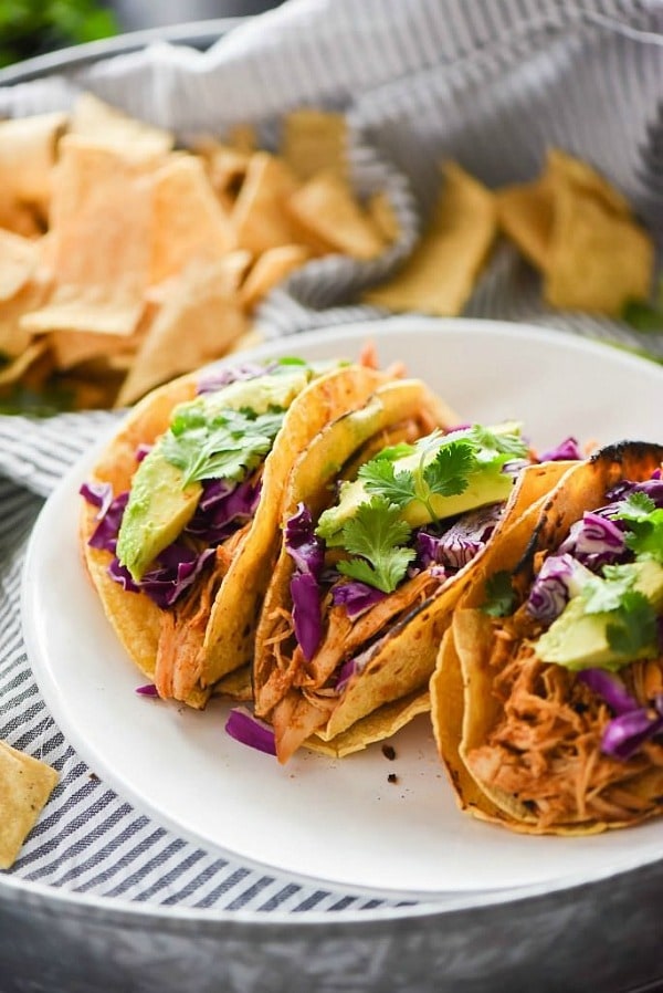 Slow Cooker Honey Chipotle Chicken Tacos are slightly sweet and slightly spicy! The slow cooked chicken is fall apart tender, juicy and full of chipotle and honey! Delicious in tacos or over lettuce for a lighter option!