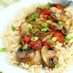 Baked "Smothered Chicken" may sound weird, but this is an incredibly easy and delicious one-pan, baked chicken dinner recipe that my family loves! It's healthy and high in protein and is low-carb & gluten-free without the side of rice. Super easy and no pre-cooking of the meat, just throw it all in the pan and bake! It comes out juicy and flavorful!