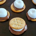 Oven S'mores Sandwiches for the WIN! You don't need a campfire to enjoy s'mores, make them in the oven instead! These oven smores are incredibly easy to make (about 5 minutes total!) and are the perfect combo of salty and sweet. So delicious! AD