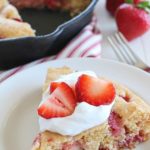 This Strawberry Skillet Corn Cake is full of strawberry goodness! It's super easy to make, with only a few ingredients and absolutely perfect to serve for brunch, dessert or a fun snack!
