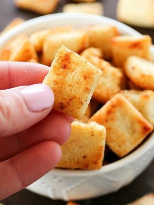 Garlic Parmesan Homemade Croutons are easy to make and cheaper than the store-bought kind! Tons of garlic parmesan flavor make these homemade croutons out of this world!!