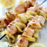Salmon Skewers tossed in a garlic-lemon sauce and then grilled. So simple and so flavorful! Salmon and citrus is combined to create the result of a crazy delicious, tender, lemony salmon that is like heaven on a stick!