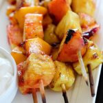Fruit Skewers are grilled with a sweet cinnamon glaze and dipped in a delicious easy yogurt dip! You will go crazy for these grilled fruit skewers! AD