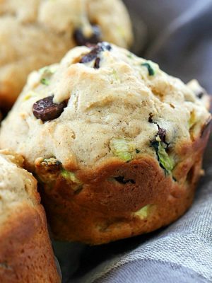 These Chocolate Chip Zucchini Muffins are the best of both worlds - healthy AND decadent! They're full of tender zucchini and chocolate chips but are made healthier by using applesauce instead of lots of butter. These make a yummy breakfast or after school snack!