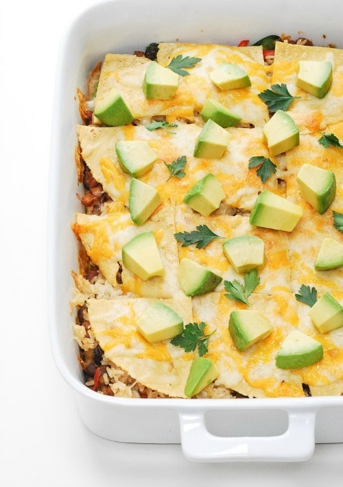 This simple, vegetarian Mexican Lasagna is a family favorite recipe! It still hits that comfort feeling you’re looking for, just with healthier ingredients like brown rice, spinach, beans, and peppers.