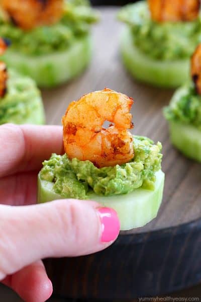 This Low Carb Avocado Shrimp Cucumber Appetizer has a base of sliced cucumber, then mashed avocado and topped off with spicy grilled shrimp. SO GOOD!
