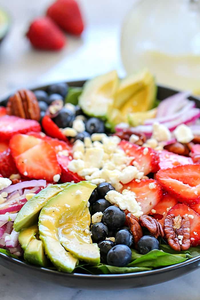 This Spinach Salad Recipe with blow your mind! It's super easy to throw together and has so much flavor! #ad