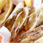Overhead view of dessert egg rolls cut in half.